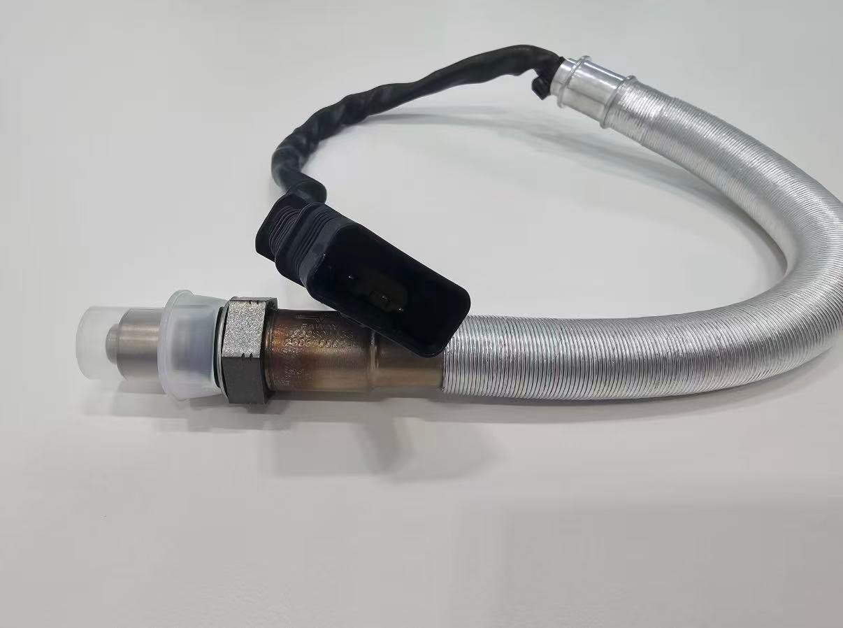 Direct-fit wideband oxygen sensor with heat shield for physical comparison during Honda fitment review Direct-fit wideband oxygen sensor with heat shield for physical comparison during Honda fitment review